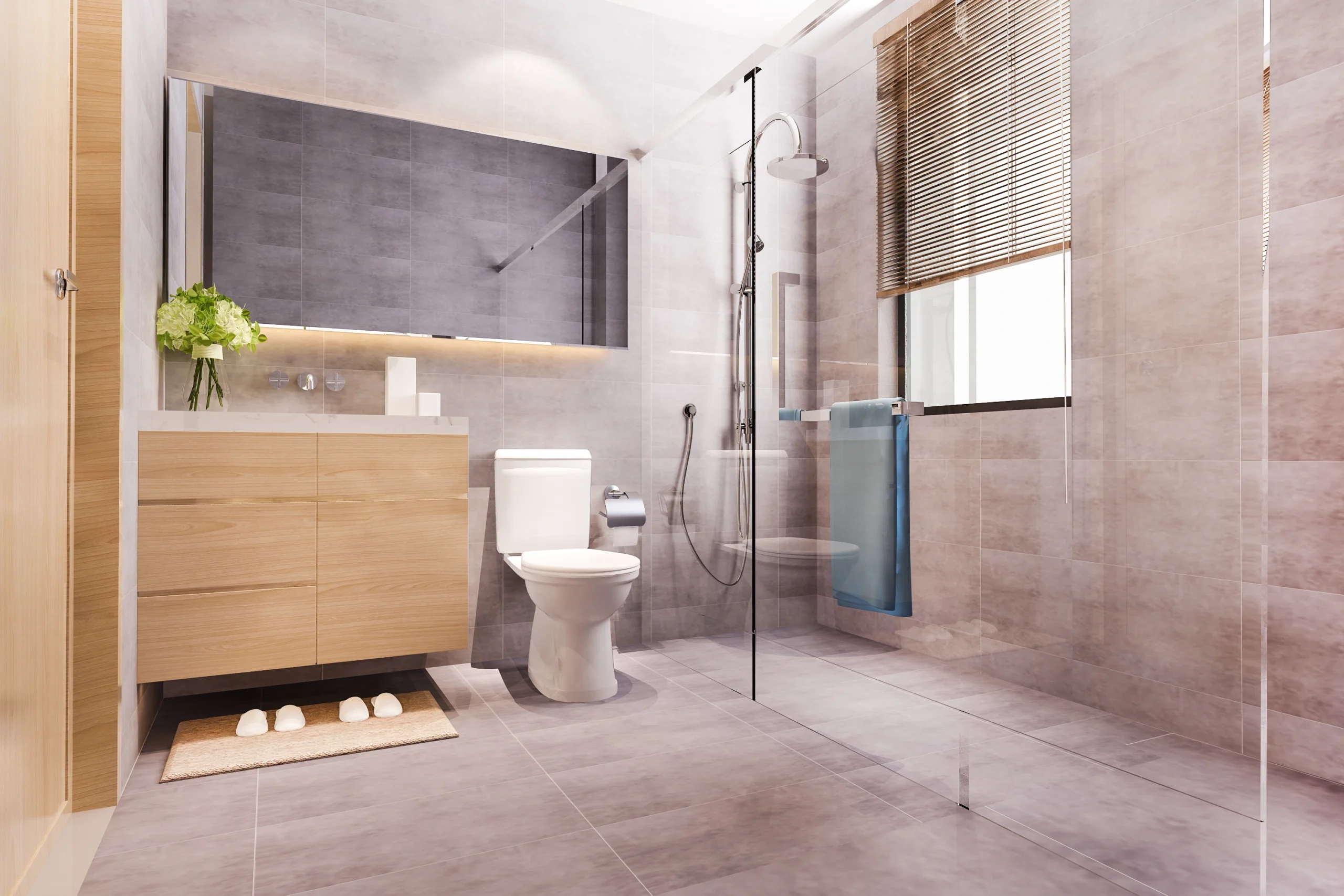 Modern bathroom featuring beige marble tiles, glass walk-in shower, wooden floating vanity, and large illuminated mirror.